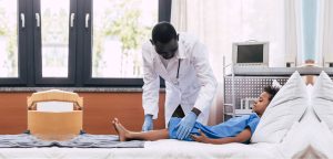 doctor examining young boy