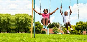 kids playing on a swing