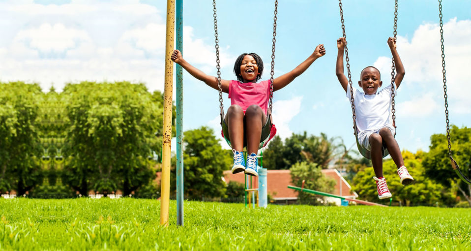 kids playing on a swing