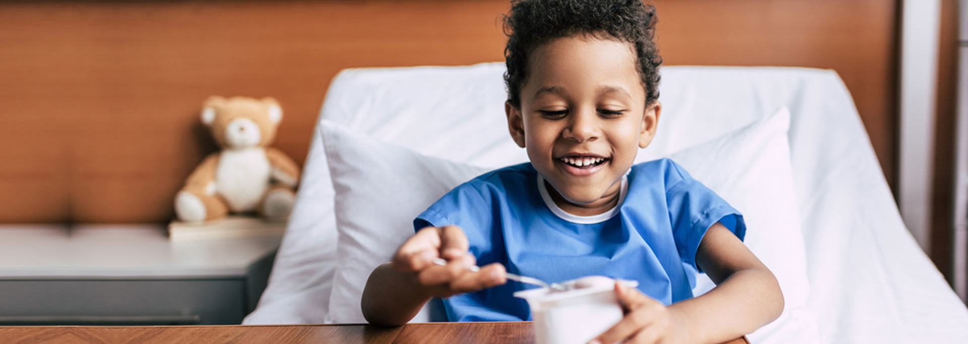 Smiling child in a hospital ward