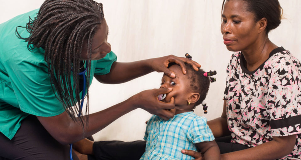 doctor examining young girl